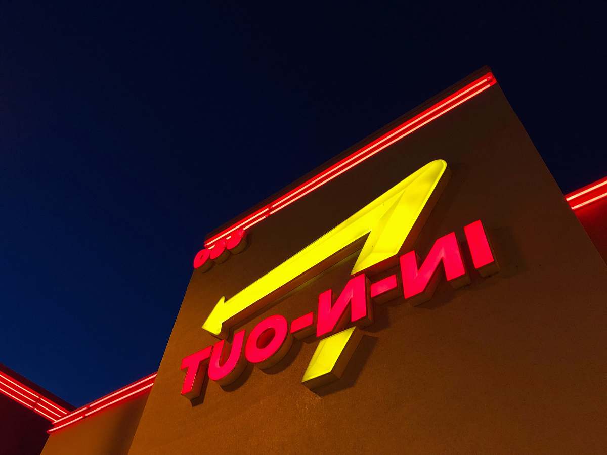 in-n-out burger low angle photography of red and yellow In-N-Out signage san jose
